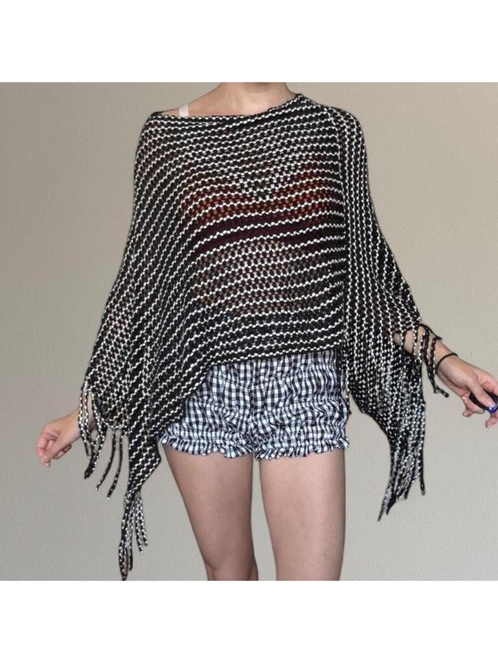 Striped knit fringe poncho.